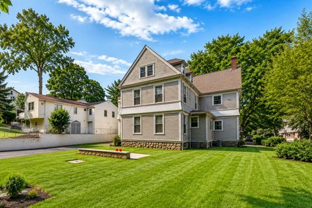 27.67 E Clinton Sunny suburban yard with lush greenery