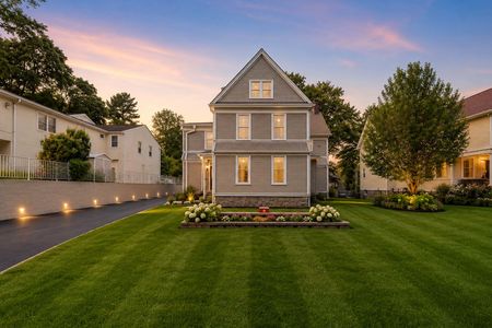 28. 67 E Clinton Golden-hour glow over suburban home