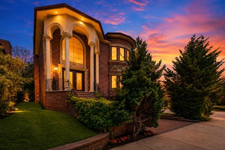 3. 335 Riverdale Twilight glow over luxurious suburban home