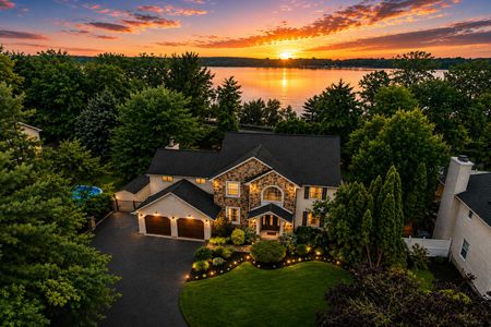 3. 5 Gates Pl. Sunset over lakeside suburban home