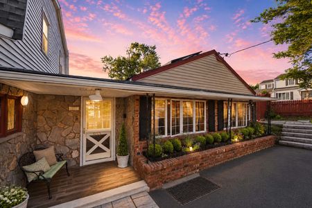 3. 933 River Rd. Cozy home at sunset with garden details