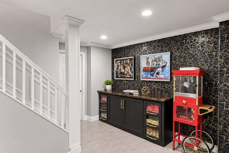 39. 5 Gates Pl. Modern basement rec room with vibrant accents