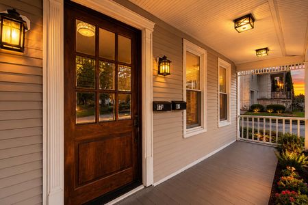 4. 67 E Clinton Cozy porch at sunset with lanterns