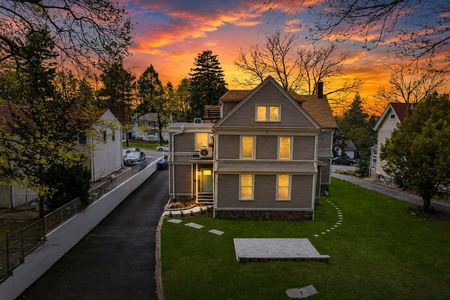 4. 69 E Clinton #A Twilight suburban home at sunset