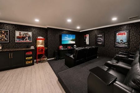 40. 5 Gates Pl. Cozy home theater with movie posters