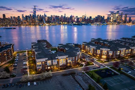 40.26 Ave Port Imperial Twilight cityscape by the river