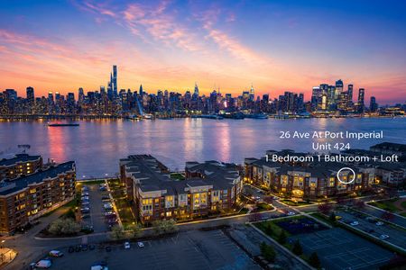 41. 26 Ave Port Imperial Waterfront skyline at sunset with condo details