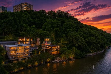 41. 35 Shore Tranquil riverside sunset with modern homes