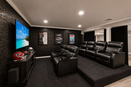 41. 5 Gates Pl. Modern home theater with sports memorabilia