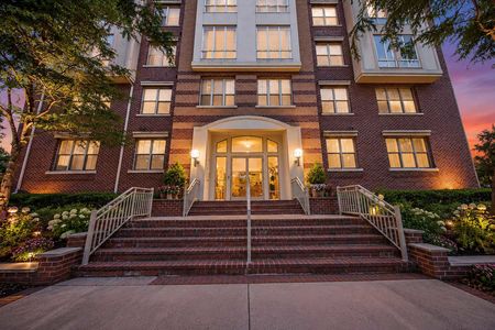 44. 26 Ave Port Imperial Elegant brick building at sunset