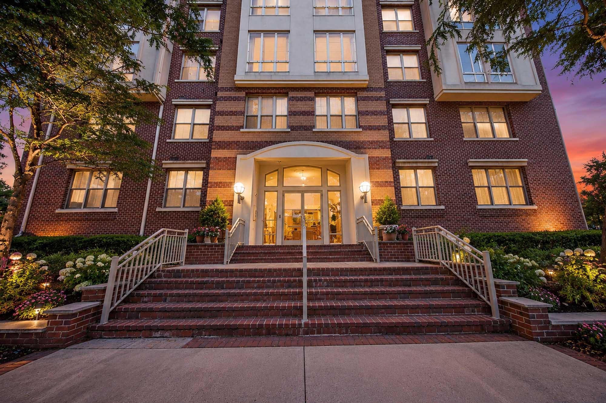 44. 26 Ave Port Imperial Elegant brick building at sunset