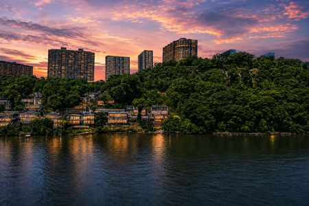 47. 35 Shore Serene waterfront cityscape at twilight