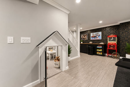 47. 5 Gates Pl. Modern basement game room with play nook