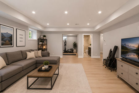 48. 14 Allison Modern basement living space with TV setup