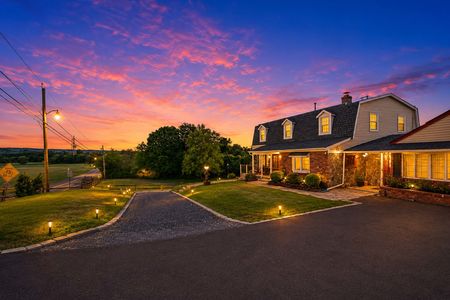 48. 933 River Rd. Cozy home at twilight with glowing sky