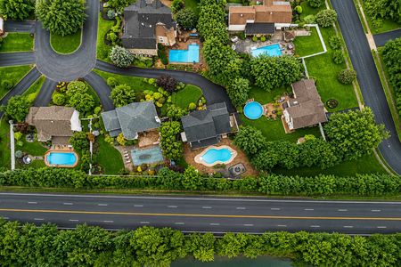 49. 5 Gates Pl. Suburban neighborhood with pools and greenery