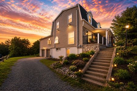 49. 933 River Rd. Charming home under a colorful sunset sky