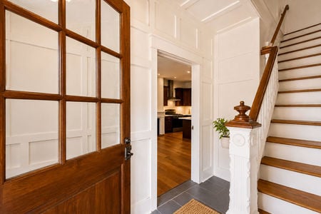 5. 67 E Clinton Warm farmhouse entry with wooden staircase