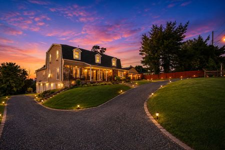 50.933 River Rd. Sunset over a serene country home