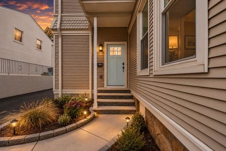6. 69 E Clinton #A Golden-hour entrance with cozy ambiance