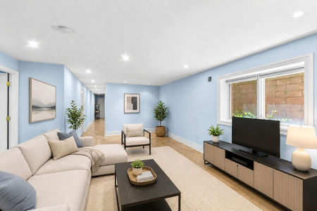 63. 335 Riverdale Modern basement living room with neutral decor