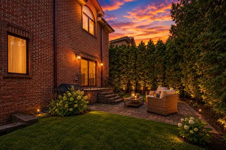 69. 335 Riverdale Cozy backyard patio under sunset glow