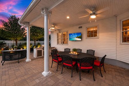 7. 5 Gates Pl. Twilight patio with sunset and garden