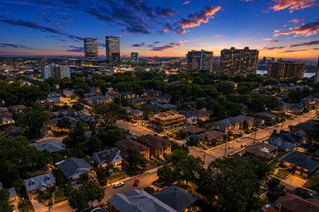 72. 335 Riverdale Evening cityscape with glowing skyline