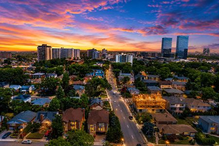 73. 335 Riverdale Sunset over a vibrant city neighborhood