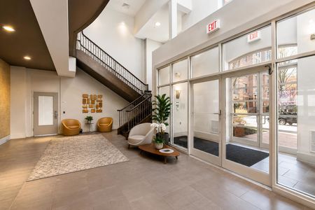 8. 26 Ave Port Imperial Modern and airy lobby with plants