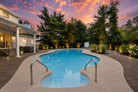8. 5 Gates Pl. Serene sunset over luxurious backyard pool