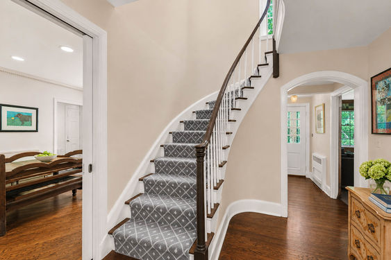 0.61 16 N Brae Elegant Neutral Foyer with Curved Staircase