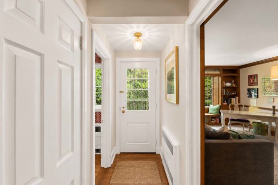 0.62 16 N Brae Warm Traditional Hallway with Wrought-Iron Entry Door