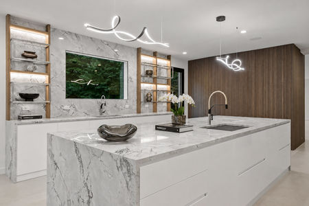 28. 1 Lambs Minimalist Marble Kitchen with Orchid Accents