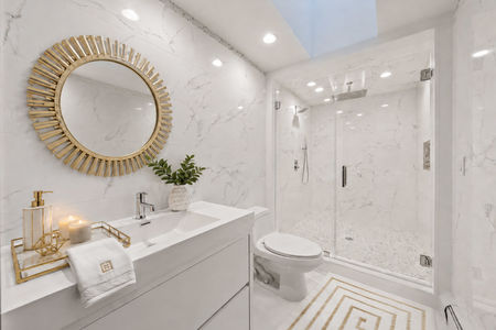 43. 1 Lambs Luxurious White Marble Bathroom with Gold Accent