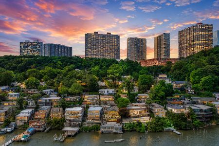 50. 23 Shore Twilight Waterfront Cityscape Beneath a Colorful Sky