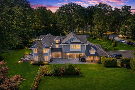 75. 108. Briarwood Twilight Glow Over a Grand Suburban Home