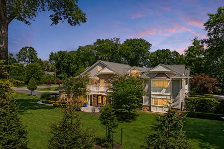 82. 108 Briarwood Twilight Glow Over an Elegant Suburban Home