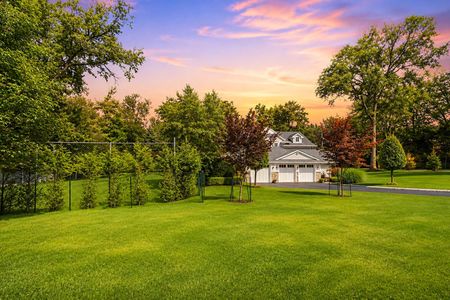 88. 108 Briarwood Pastel Sunset Over a Landscaped Suburban Lawn