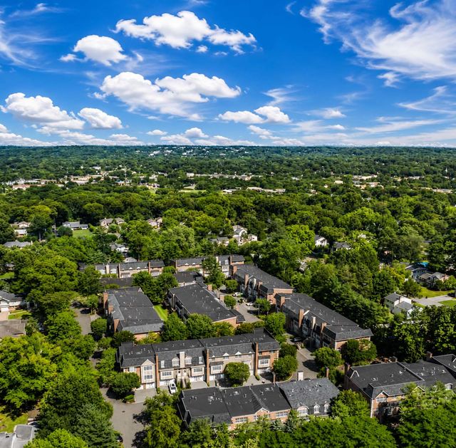 Stonegate Aerial Suburban Neighborhood Under Blue Skies