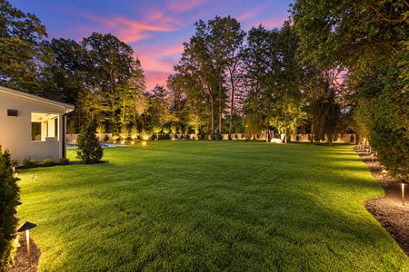 0.05 Flat back yard at 90 Essex Dr, Tenafly NJ Exterior at Twilight