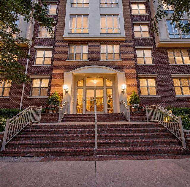 26 Ave Port Imperial Elegant brick building at sunset