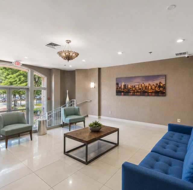 26 Ave Port Imperial Modern lobby with city skyline view