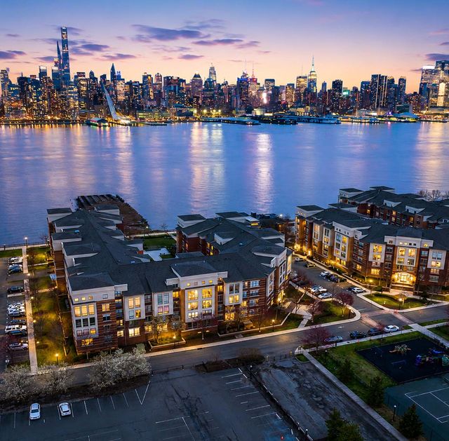 26 Ave Port Imperial Twilight cityscape by the river