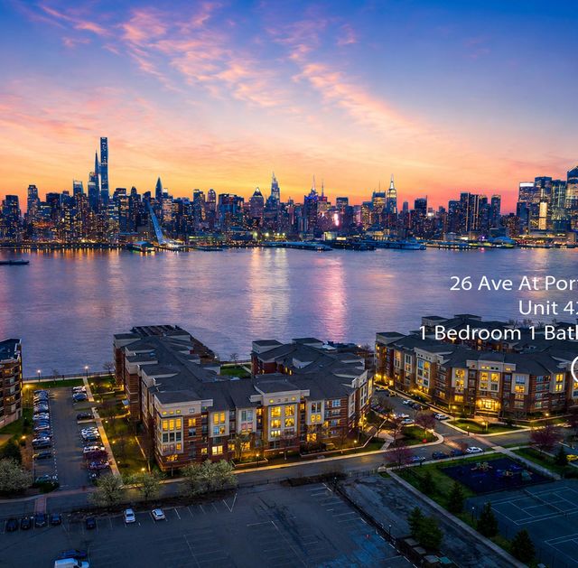 26 Ave Port Imperial Waterfront skyline at sunset with condo details