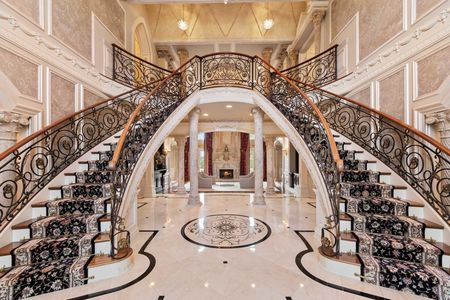 10 Foyer and double bridle staircase of a castle in Cresskill