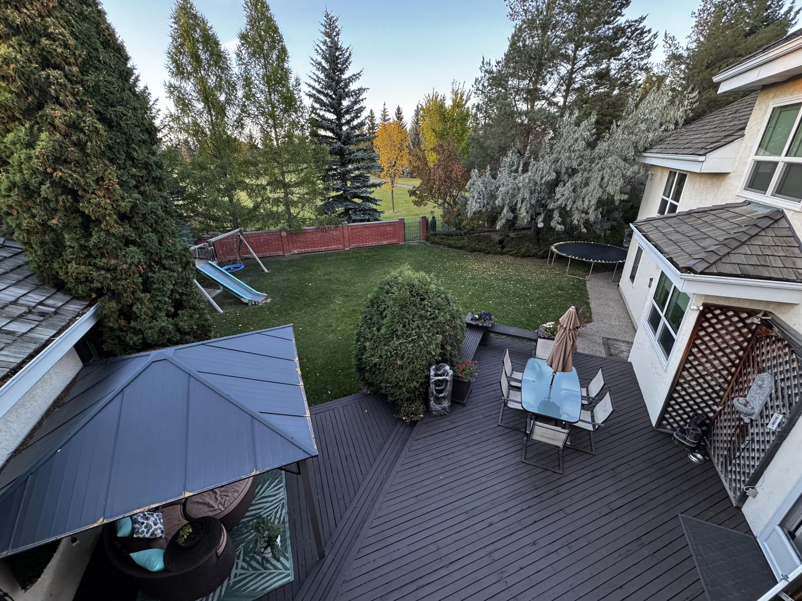 Looking down onto the two-tier deck and the lawn beyond from the upper floor.