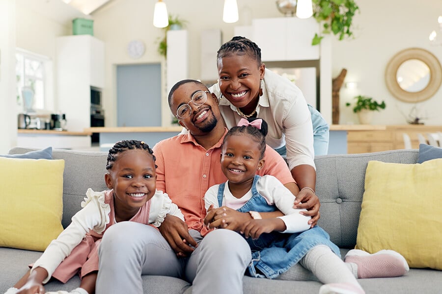 family-on-sofa-and-in-living-room