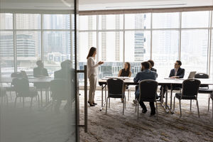 Project leader woman talking to colleagues