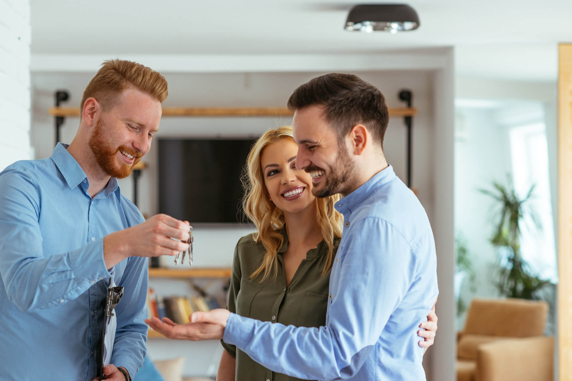 happy couple receiving keys 1